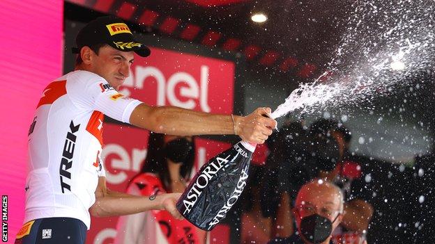 Italy's Giulio Ciccone sprays champagne on the podium after winning stage 15 of the 2022 Giro d'Italia