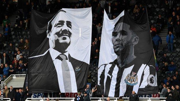 The banner of Rafael Benitez and Jamaal Lascelles