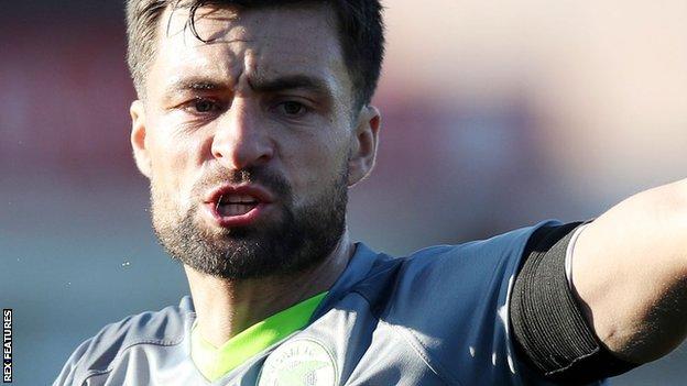 Russell Martin: Scotland international leaves Walsall for family