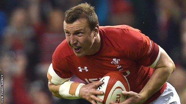 Hadleigh Parkes celebrates as he goes over to score Wales' opening try