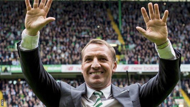 Celtic manager Brendan Rodgers celebrates with supporters