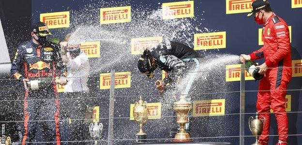 Max Verstappen, Lewis Hamilton and Charles Leclerc on the podium