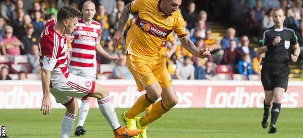 Motherwell player Ryan Bowman wins a penalty after being brought down by Darren Lyon