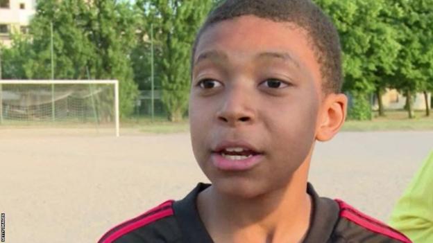 Kylian Mbappe, aged 12, wearing an AC Milan shirt while playing for Bondy, in the Paris suburbs