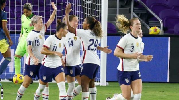 Megan Rapinoe celebrates a goal with team-mates