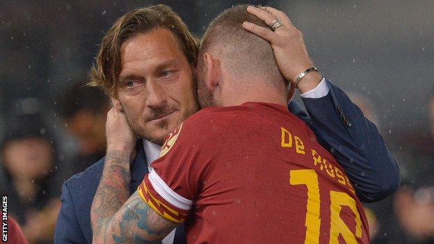 Francesco Totti and Daniele De Rossi embrace