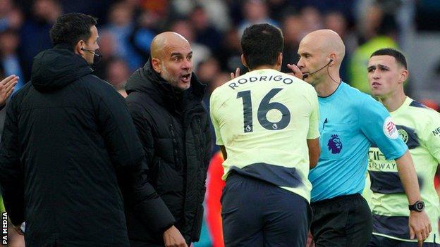 Manchester City boss Pep Guardiola and Rodri confront referee Anthony Taylor during the defeat at Liverpool.