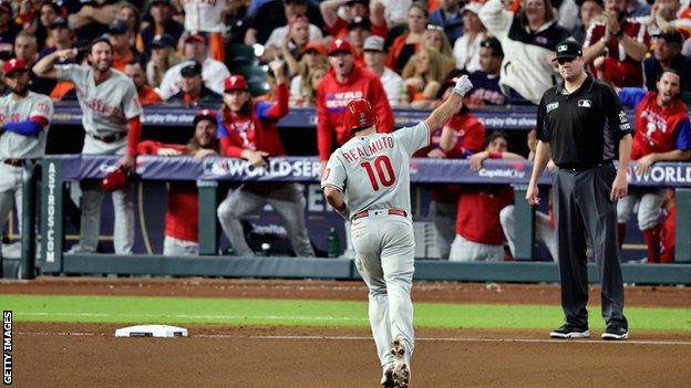 Philadelphia Phillies catcher JT Realmuto rounds the bases after this 10th-inning home run