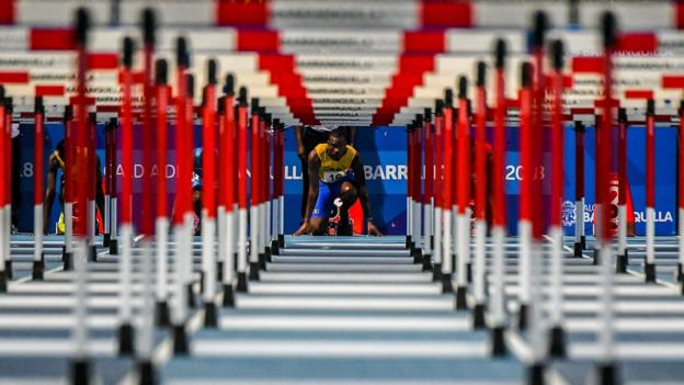 TOPSHOT - Barbados' Shane Brathwaite competes in the men's 110 m hurdles competition during the 2018 Central American and Caribbean Games (CAC) in Barranquilla, Colombia, on July 30, 2018. (Photo by Luis ACOSTA / AFP) (Photo credit should read LUIS ACOSTA/AFP/Getty Images)