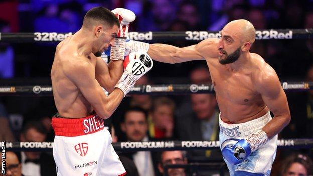 Hamzah Sheeraz blocks a shot from Bradley Skeete