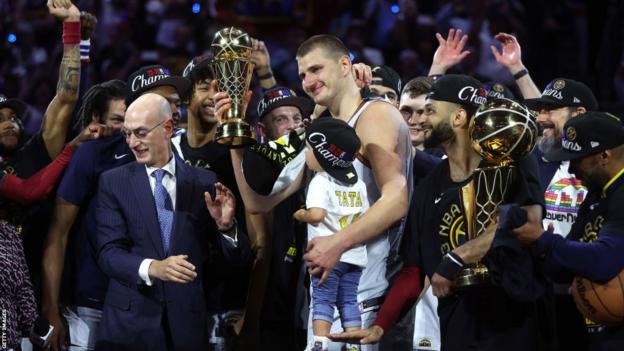 Nikola Jokic is presented the Bill Russell NBA Finals Most Valuable Player Award