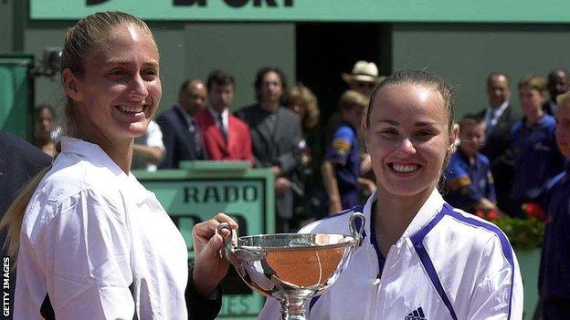Mary Pierce and Martina Hingis lift the French Open women's doubles title in 2000