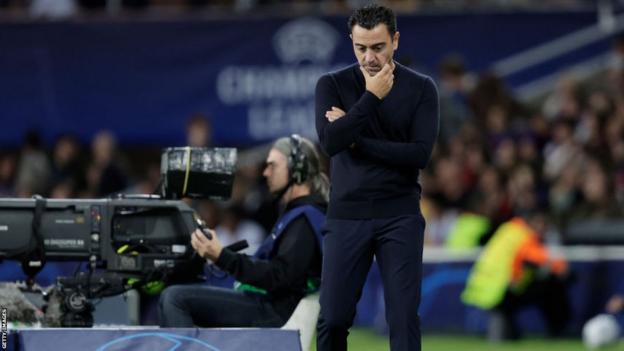 Barcelona manager Xavi watches his team play in the Champions League