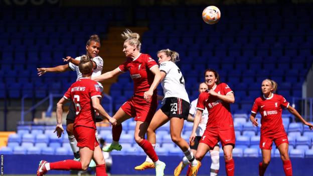 Nikita Parris of Manchester United heads towards the Liverpool net during the Women's Super League match at Prenton Park