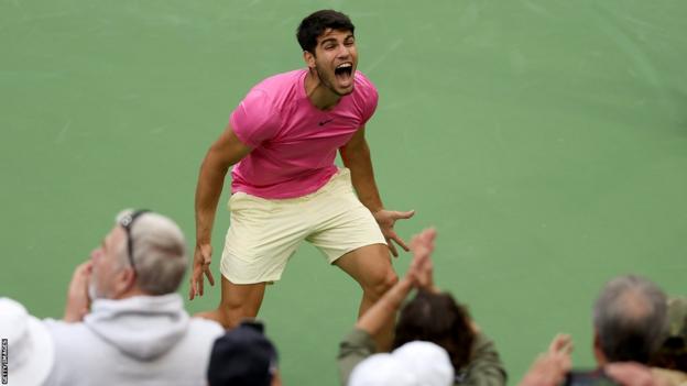 Carlos Alcaraz celebrating in front of the crowd after his Indian Wells win