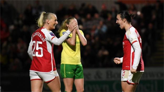 Stina Blackstenius moves to high five teammate Lotte Wubben-Moy after scoring the third goal.
