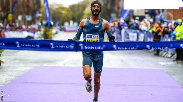 Morocco's Taoufik Allam crosses the line to take a dominant win in the men's race at the Dublin Marathon