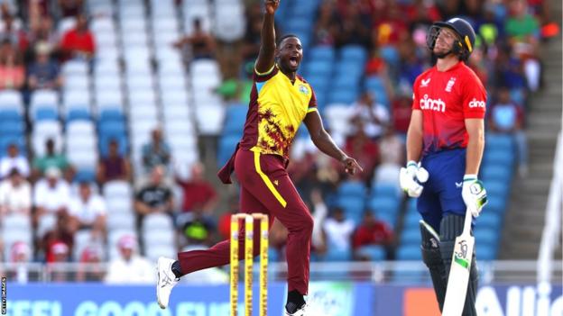 West Indies bowler Jason Holder celebrates the wicket of England captain Jos Buttler