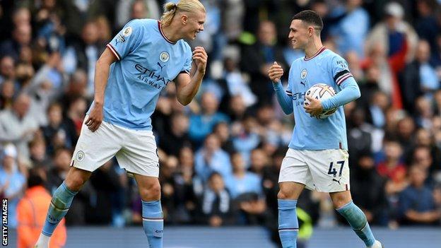 Erling Haaland and Phil Foden celebrate scoring hat-tricks for Manchester City