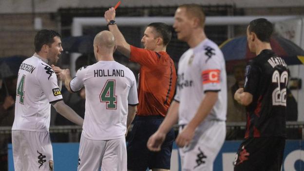 Niall Henderson becomes the second Glentoran player to be sent-off against leaders Crusaders at Seaview