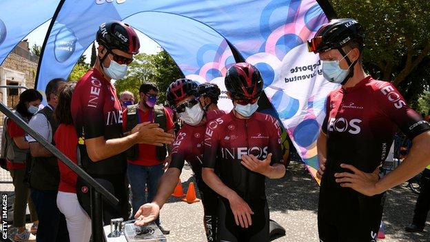 Team Ineos riders wearing face masks