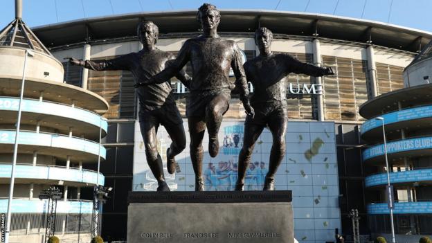 A statue of former Manchester City players Colin Bell, Francis Lee and Mike Summerbee