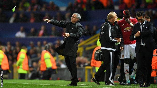 Jose Mourinho (centre) and Paul Pogba (right in red)