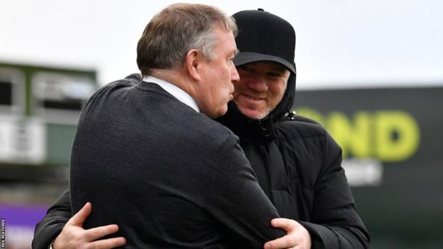 Neil Dewsnip embraces Wayne Rooney