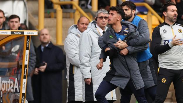 Diego Costa of Wolverhampton Wanderers holds back Matheus Nunes