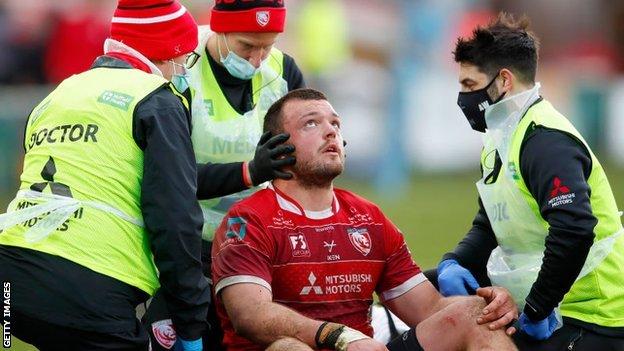 Gloucester's Jack Stanley is assessed by doctors
