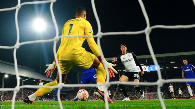 Chelsea goalkeeper Robert Sanchez denies Fulham's Sasa Lukic from point blank range