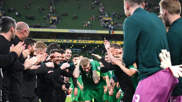 James McClean is given a guard of honour by his team-mates