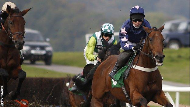 Paul Maloney riding Roadie Joe (right) on their way to winning The totepool Persian War Novices' Hurdle Race at Chepstow