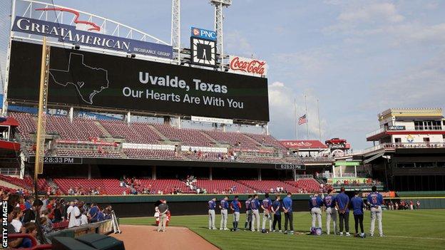 A message in honour of the victims of the mass shooting in Uvalde, Texas is displayed before the game between the Chicago Cubs and the Cincinnati Reds at Great American Ball Park on May 25, 2022 in Cincinnati, Ohio.