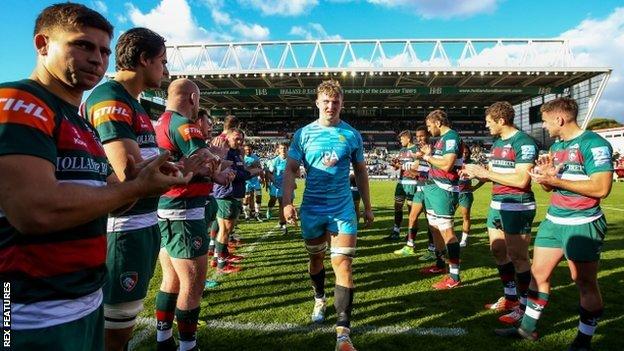 Debutant matchwinner Ted Hill leads the Worcester Warriors side off through the traditional guard of honour at Welford Road