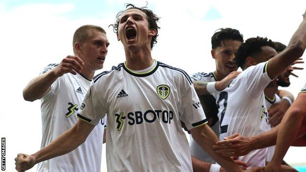 Brenden Aaronson (centre) and Leeds team-mates celebrate the winning goal over Wolves