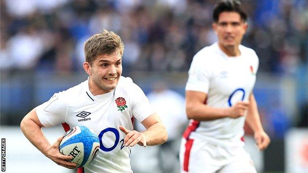 Harry Randall runs with the ball, with Marcus Smith in the background