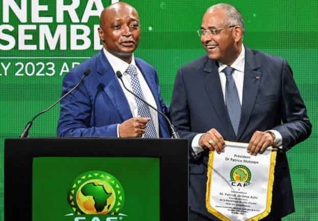 Patrice Motsepe, the president of the Confederation of African Football (left) paid tribute to the work of Patrick Achi (right) who has been serving as prime minister of Ivory Coast