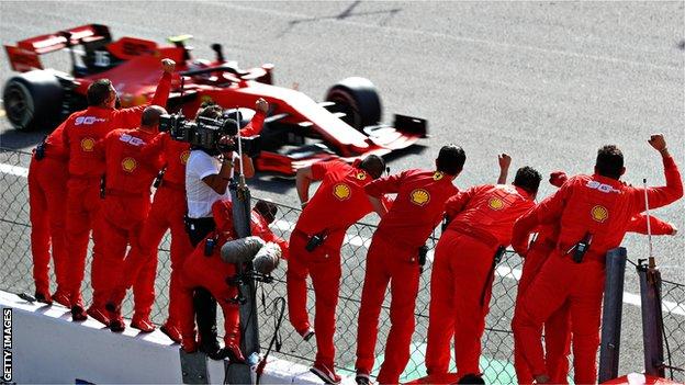 The Ferrari pitwall salute a victorious Charles Leclerc