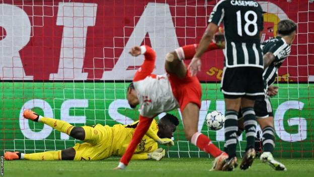 Andre Onana allows Leroy Sane's shot to make its way into the net at the Allianz Arena