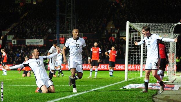 Swansea forward Andre Ayew peels away after scoring lat on at Luton