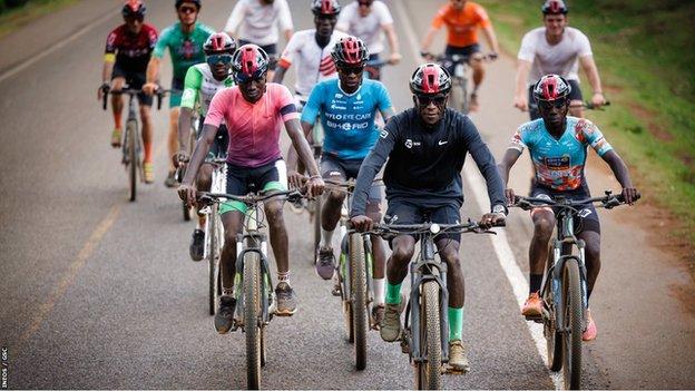 Eliud Kipchoge (front, centre) joining a ride-out from the Kaptagat training camp