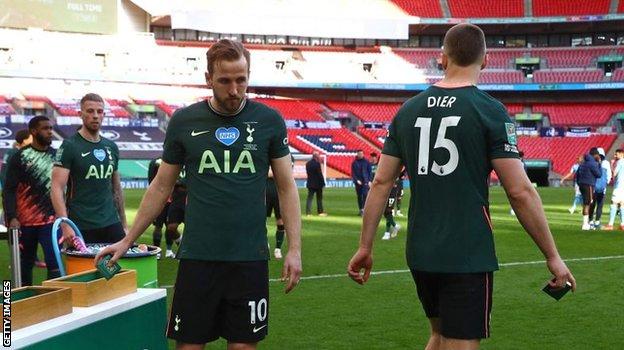 Harry Kane collects his losers' medal after Sunday's Carabao Cup final