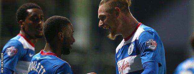 Junior Hoilett celebrates with Sebastian Polter after give QPR the lead