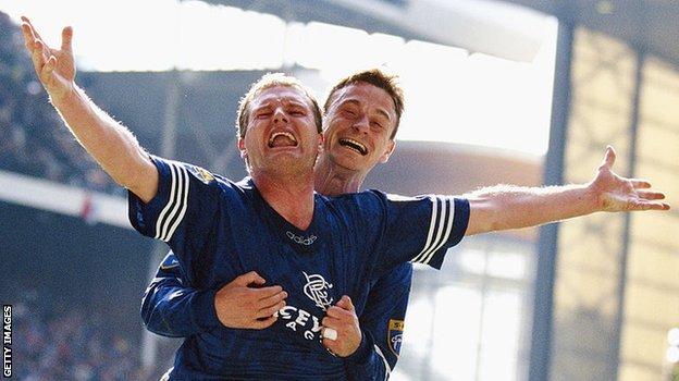 Paul Gascoigne celebrates a goal for Rangers with Davie Robertson