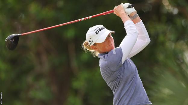 Stacy Lewis following a golf stroke