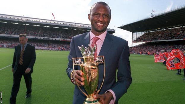 Patrick Vieira holds Arsenal's golden Premier League trophy