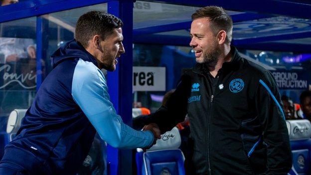 Mark Hudson and Michael Beale shake hands