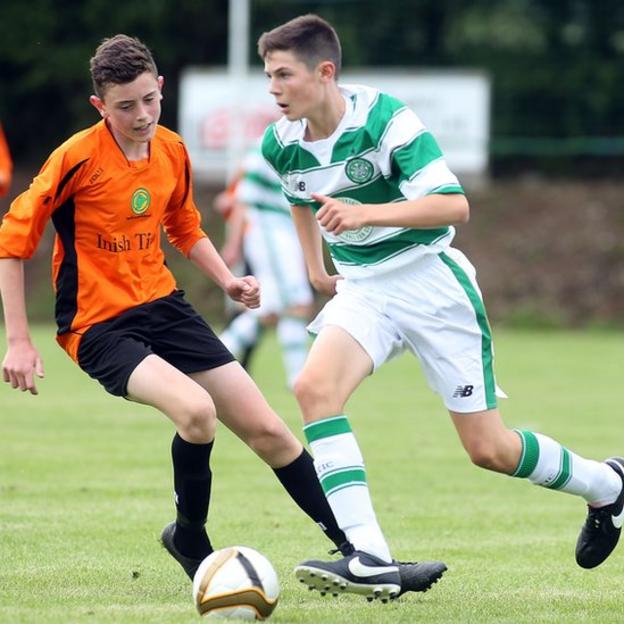 Pearse McCarron of the Inishowen League competes against Celtic's Ruaridh McIntyre