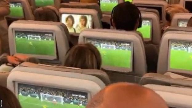 Australia fans on a plane watch the penalty shootout against France